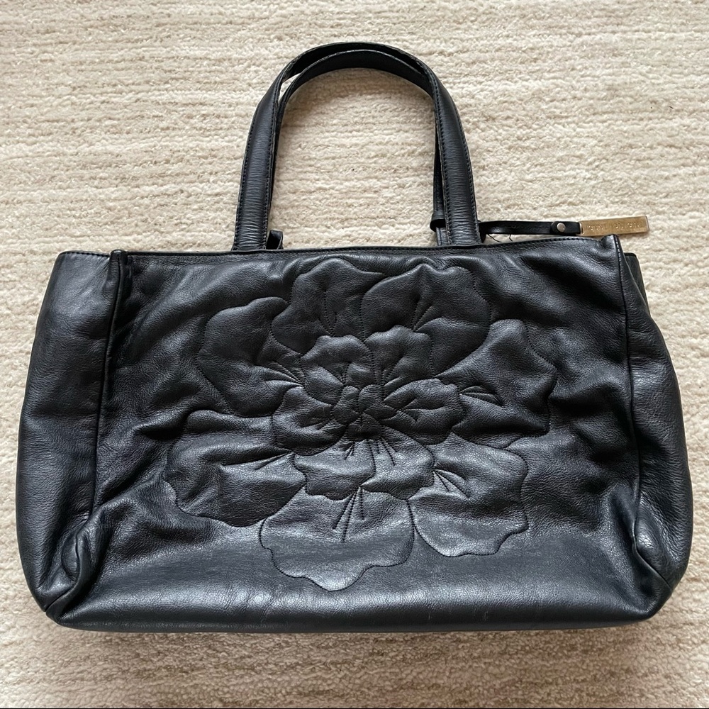 ANNE FONTAINE BLACK LEATHER SIGNATURE EMBOSSED FLOWER FRONT TOTE BAG